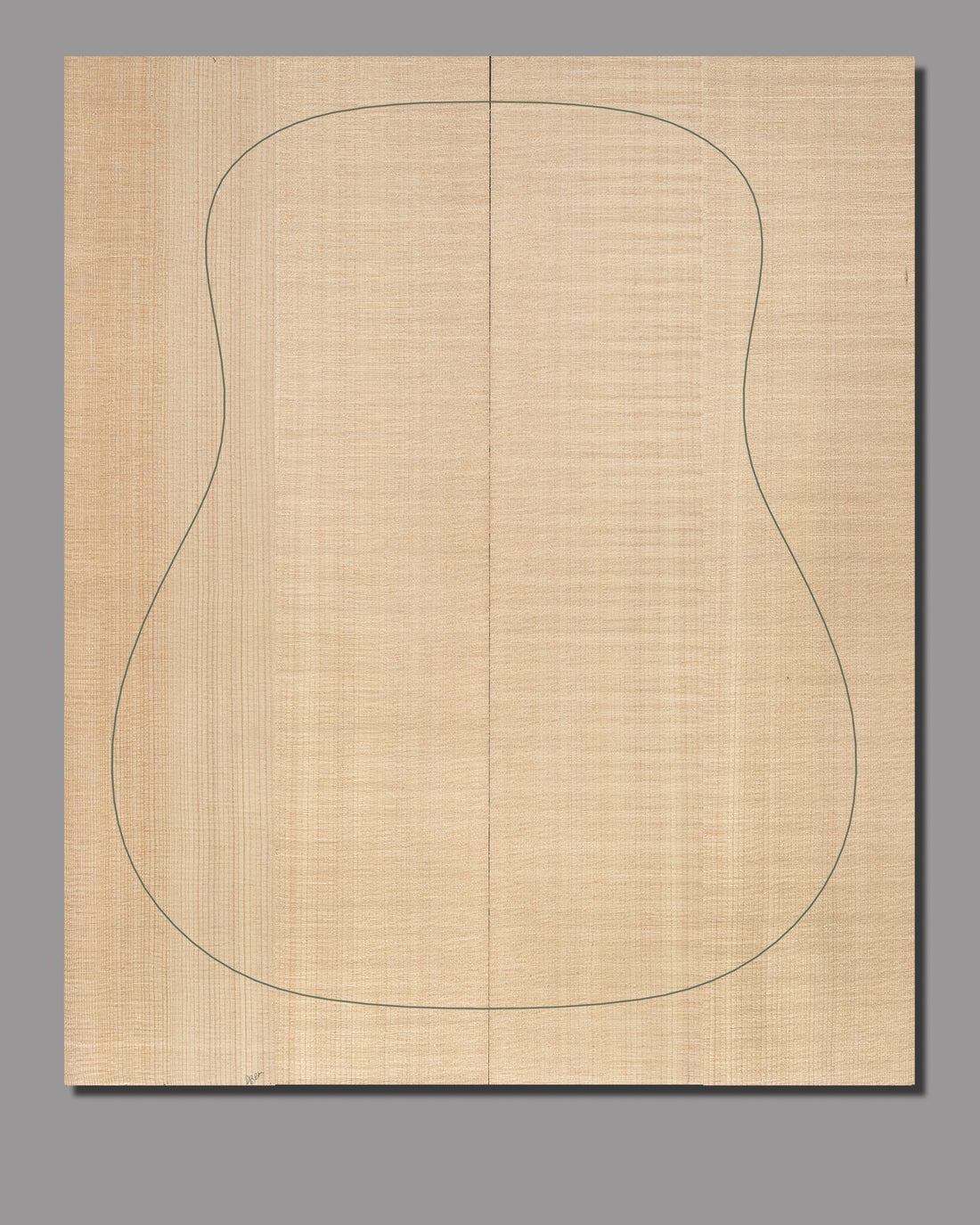Luthier-grade bookmatched Sitka spruce top with refined, even grain and a warm, golden hue.
