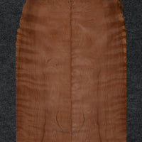 A bookmatched redwood soundboard with a warm reddish-brown hue, displaying subtle figure and grain, ideal for crafting high-quality mandolins.