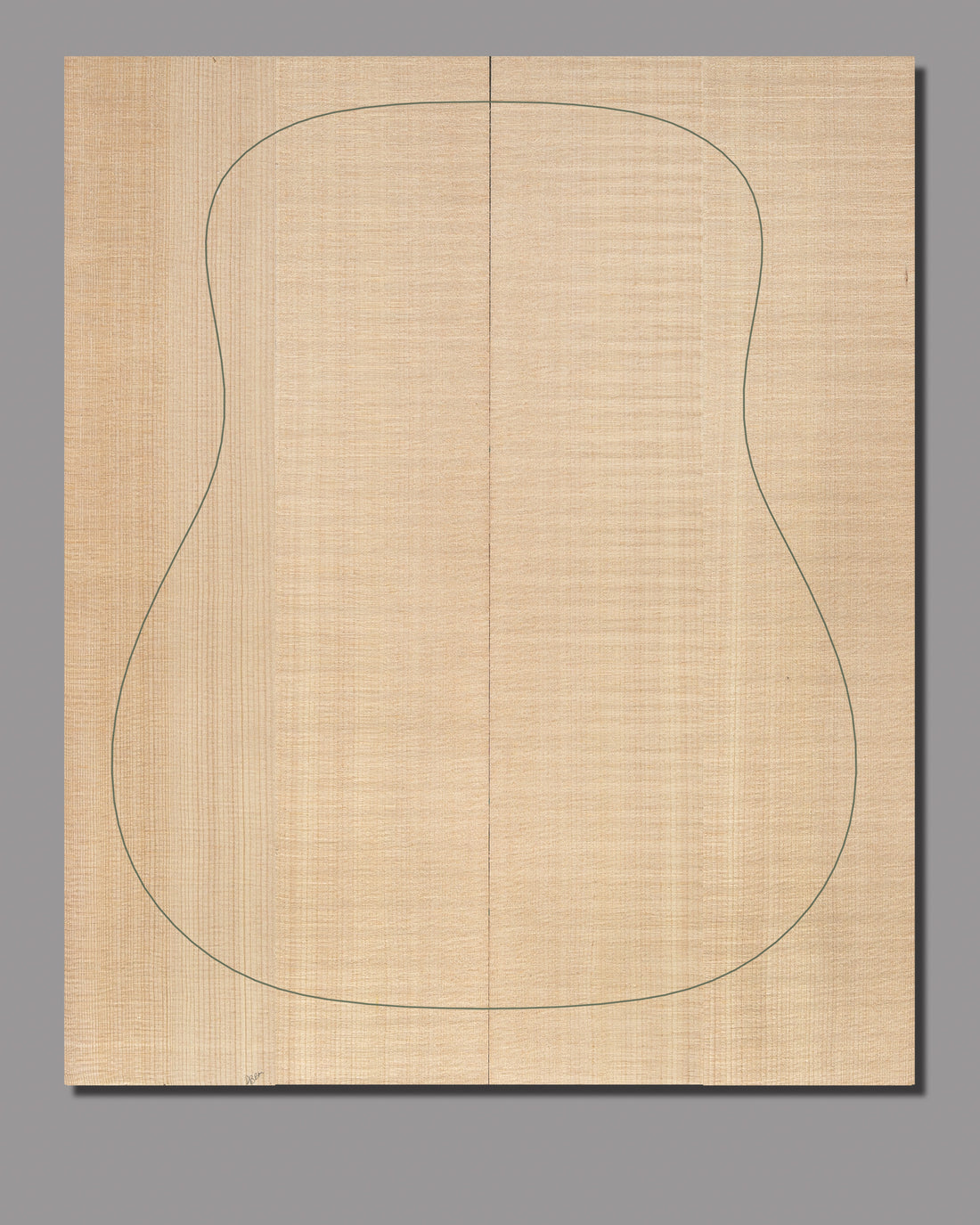 High-quality bookmatched Sitka spruce soundboard showcasing a delicate, natural golden hue with a refined, straight grain.