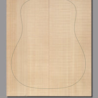 Bookmatched Sitka spruce guitar top with symmetrical grain, tight structure, and a warm golden hue, enhancing sustain and tonal depth.