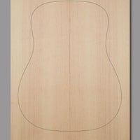 Sitka spruce soundboard with balanced symmetry and subtle golden grain patterns.