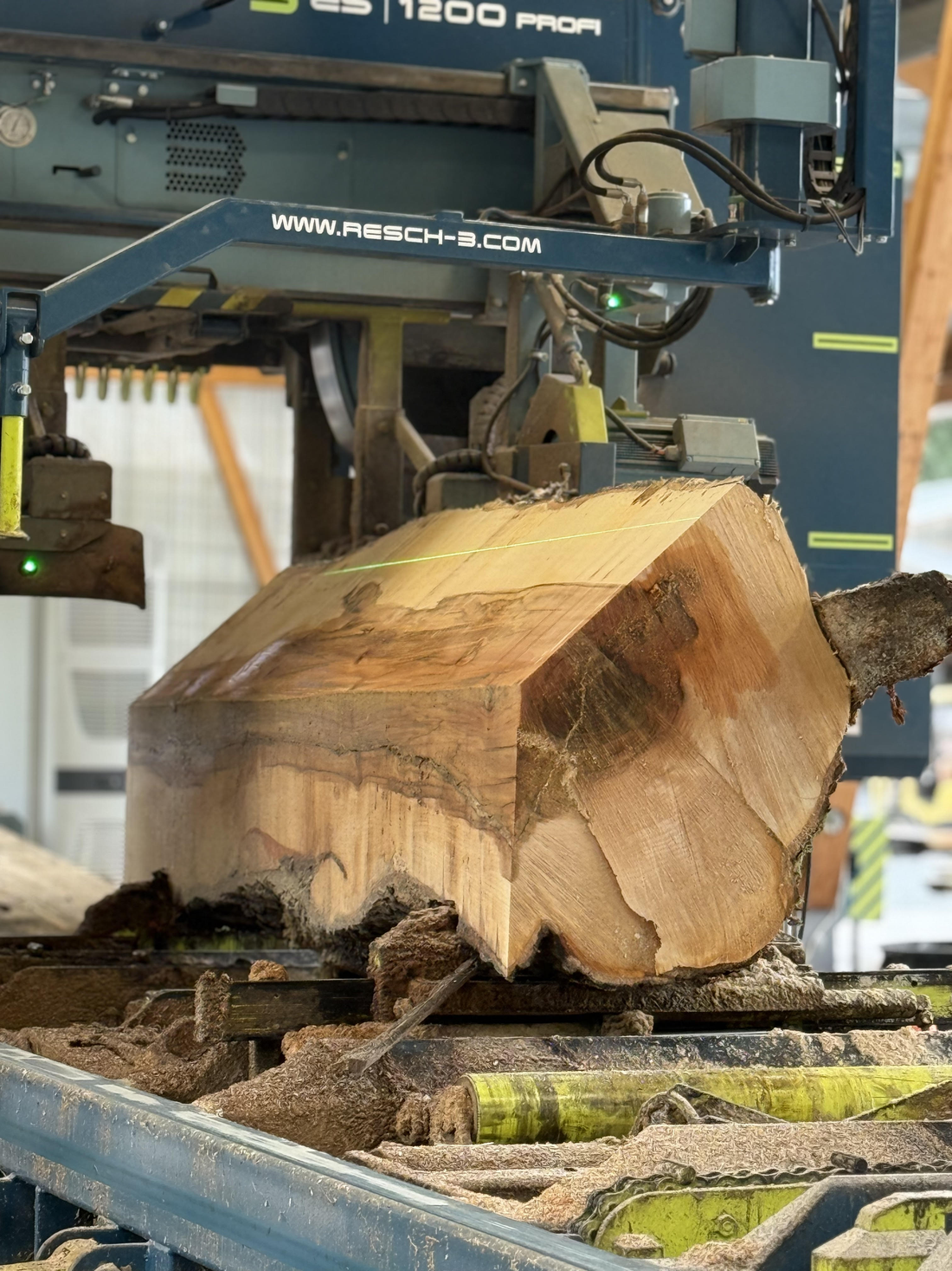 A tonewood log being cut on a Resch sawmill at Pacific Rim Tonewoods, showing precision milling that helps maximize usable wood from each log.