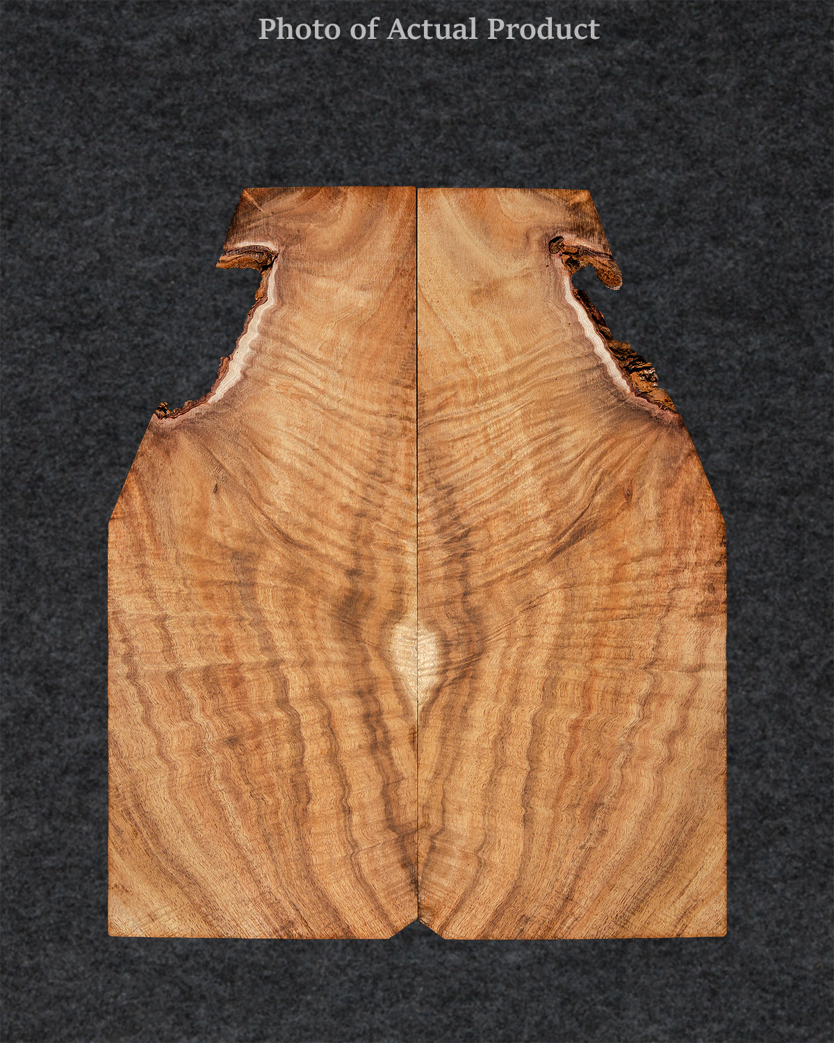 Highly figured Koa wood guitar top with golden hues, deep curl patterns, and striking contrast.