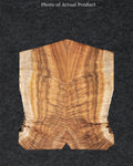 Warm Koa wood guitar top featuring tight curl figuring, amber tones, and bold grain movement.