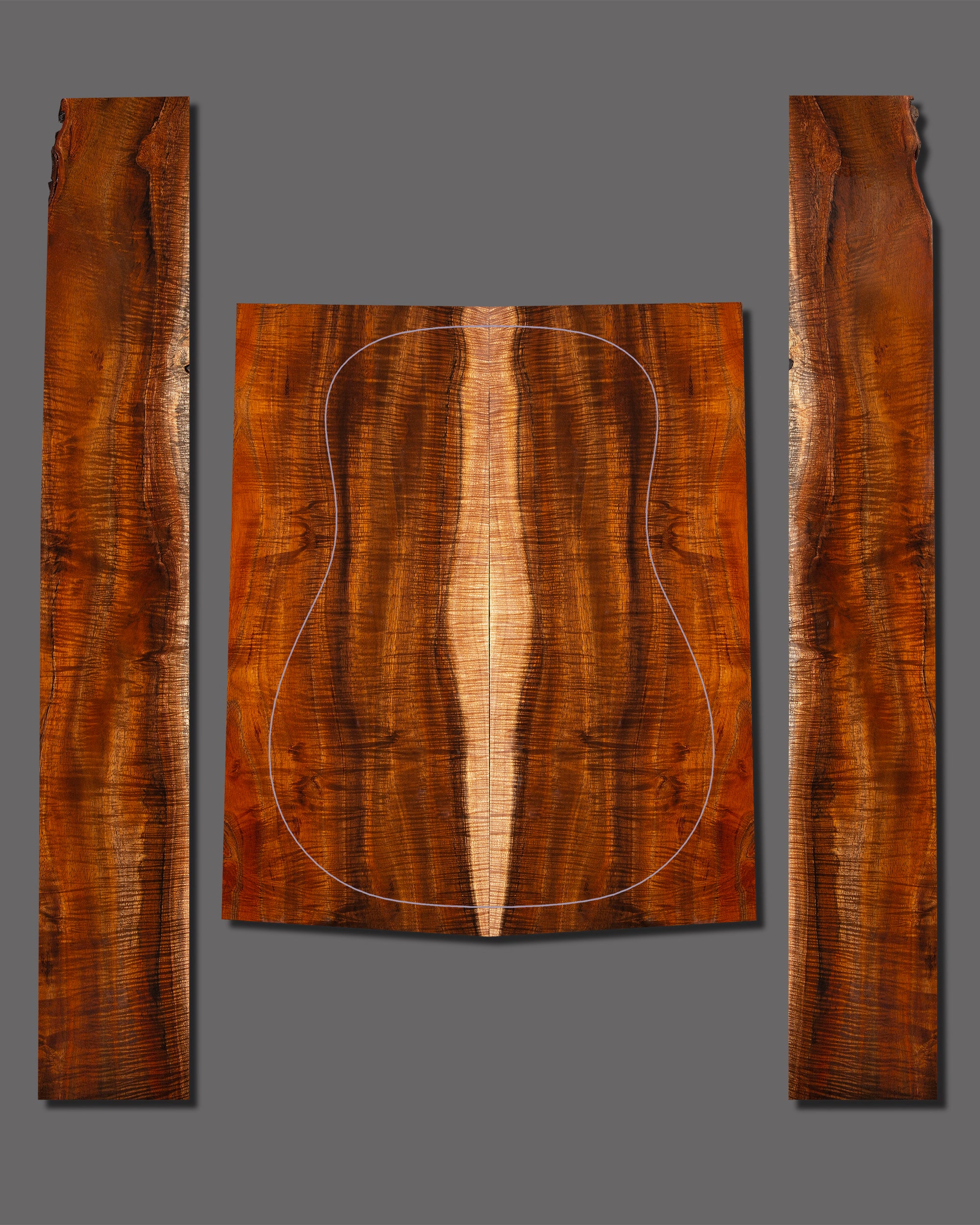 Striking figured koa set with complex flame structure and rich dark hues. Eye-catching pattern enhances any custom acoustic guitar.