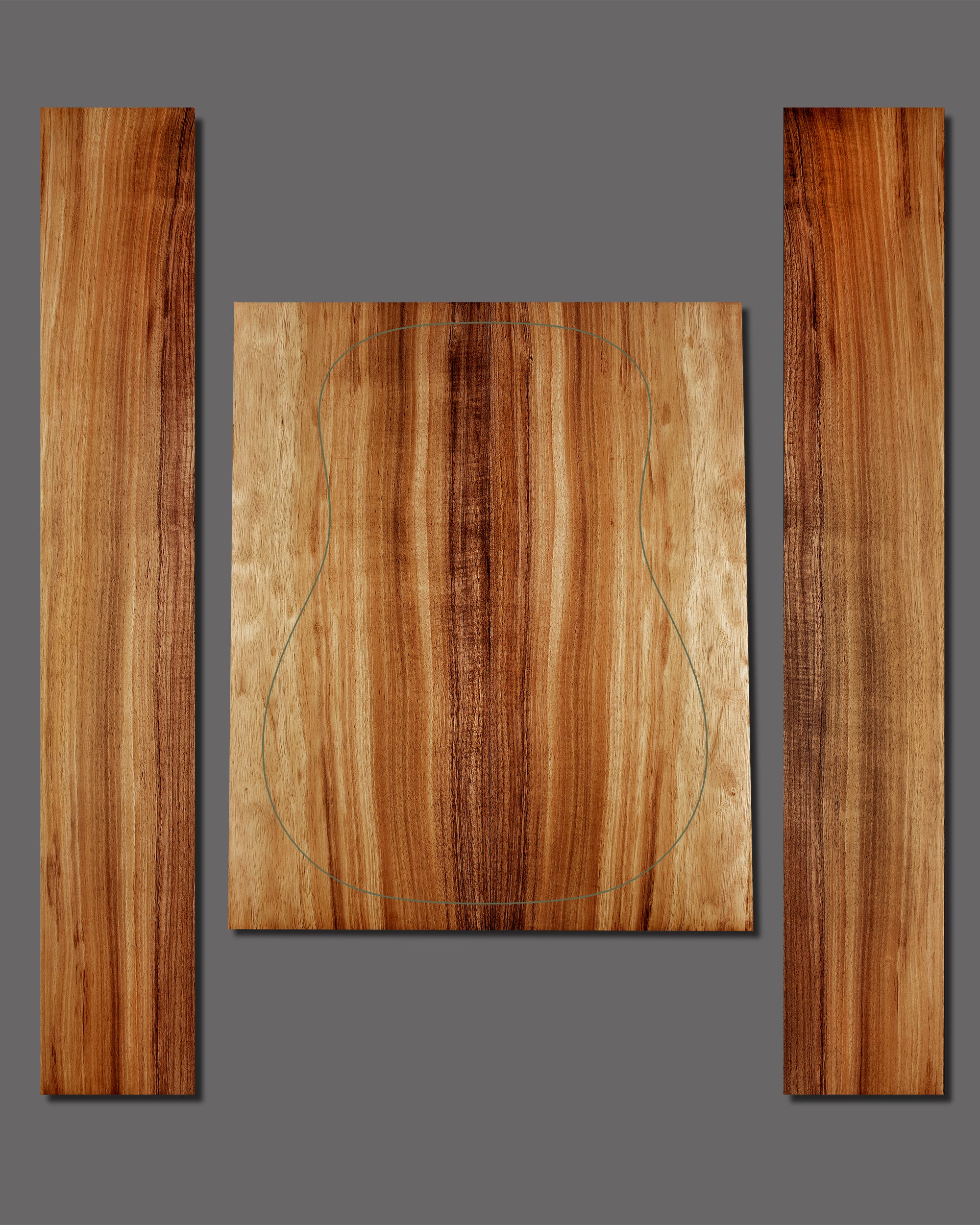 Koa guitar back and side set with straight, consistent grain and soft reddish-brown tones. A simple and elegant wood selection with gentle curl.