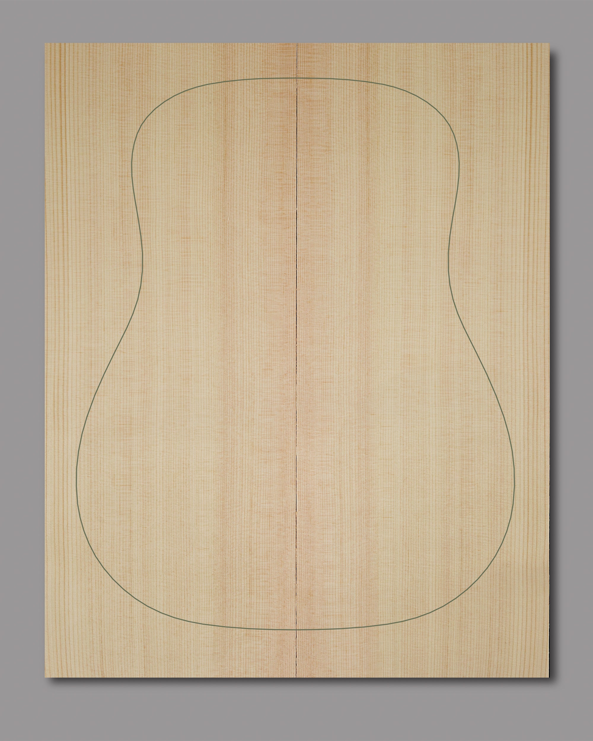 Bookmatched Lutz spruce soundboard with smooth surface and tight grain pattern.
