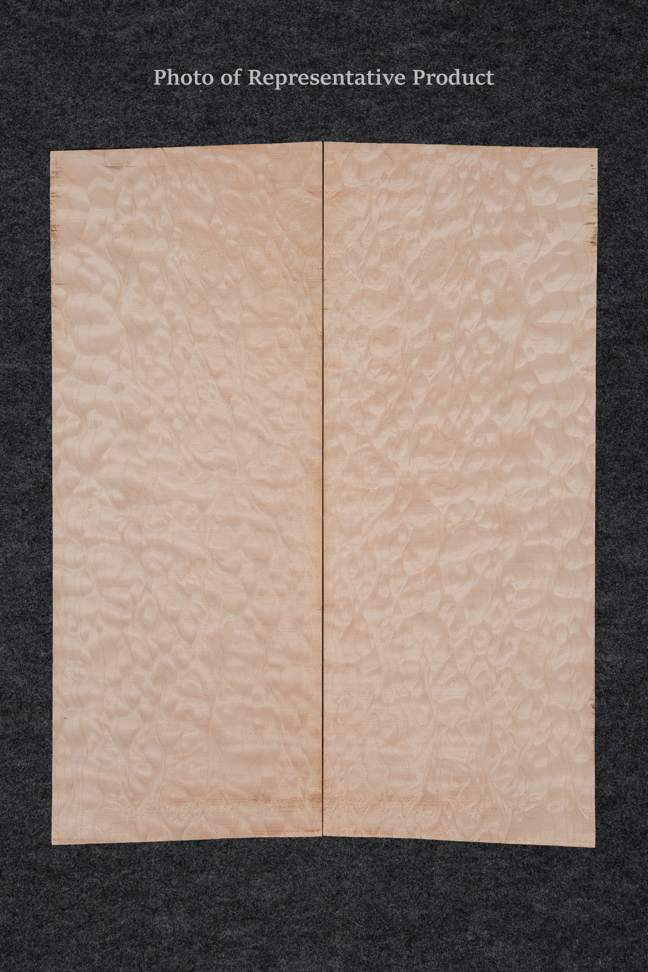 Highly figured maple mandolin soundboard with a striking quilted pattern and light golden hue, ideal for custom instrument construction.