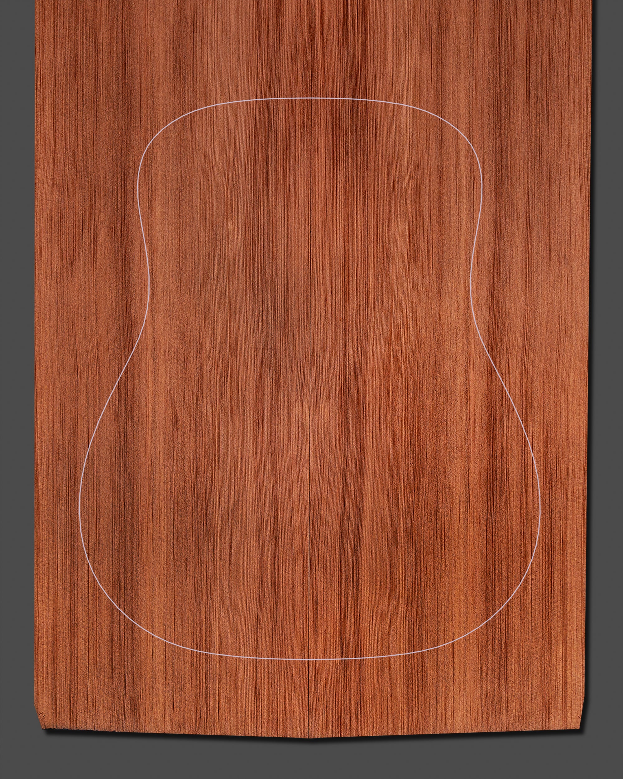 Redwood soundboard with a deep, warm color and straight grain pattern, offering superior resonance and tonal complexity.