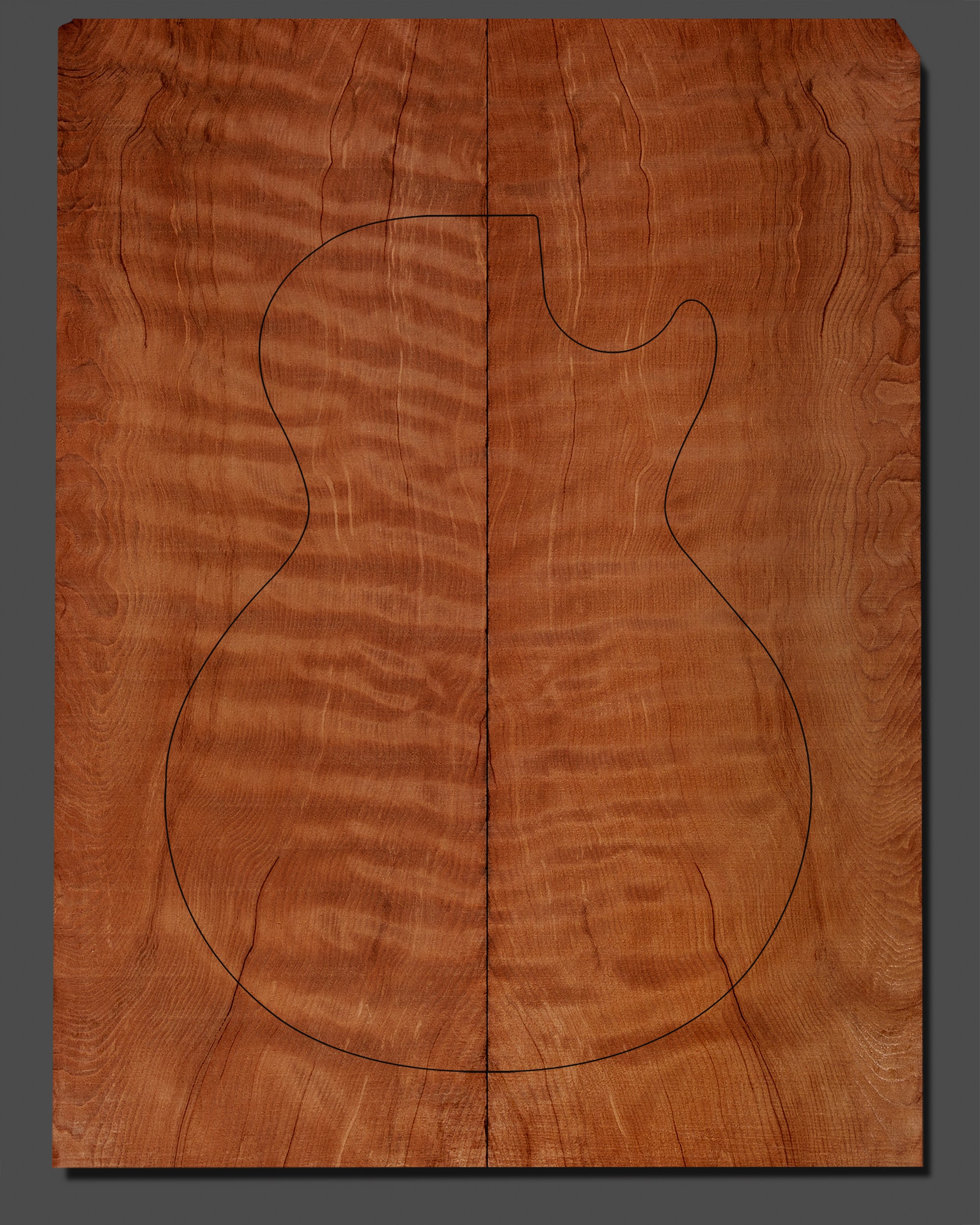 Premium redwood guitar top featuring a highly figured, rippling grain pattern. Pre-marked with an electric guitar outline for precision crafting.