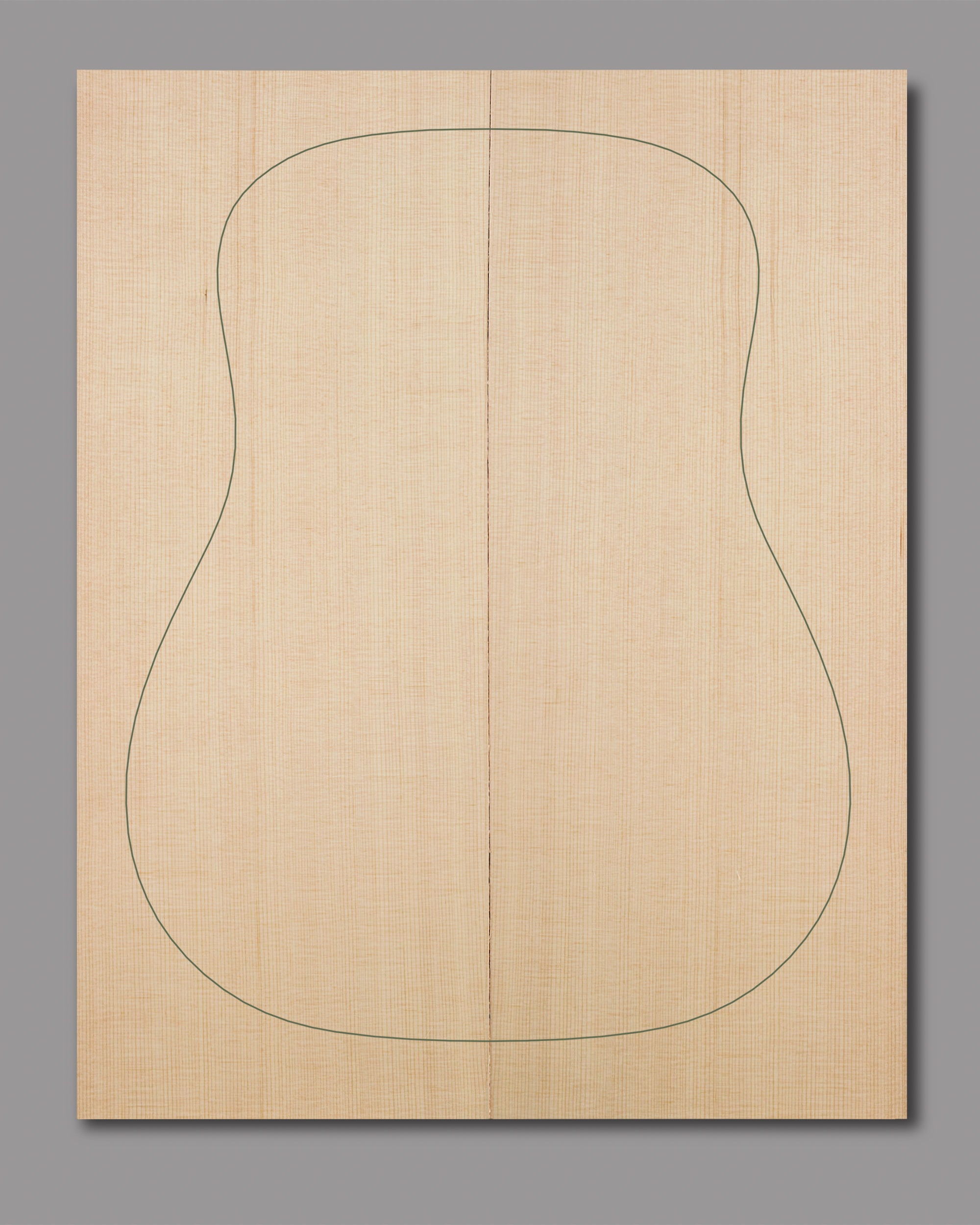 Premium Sitka spruce soundboard with straight, tight grain and natural symmetry.