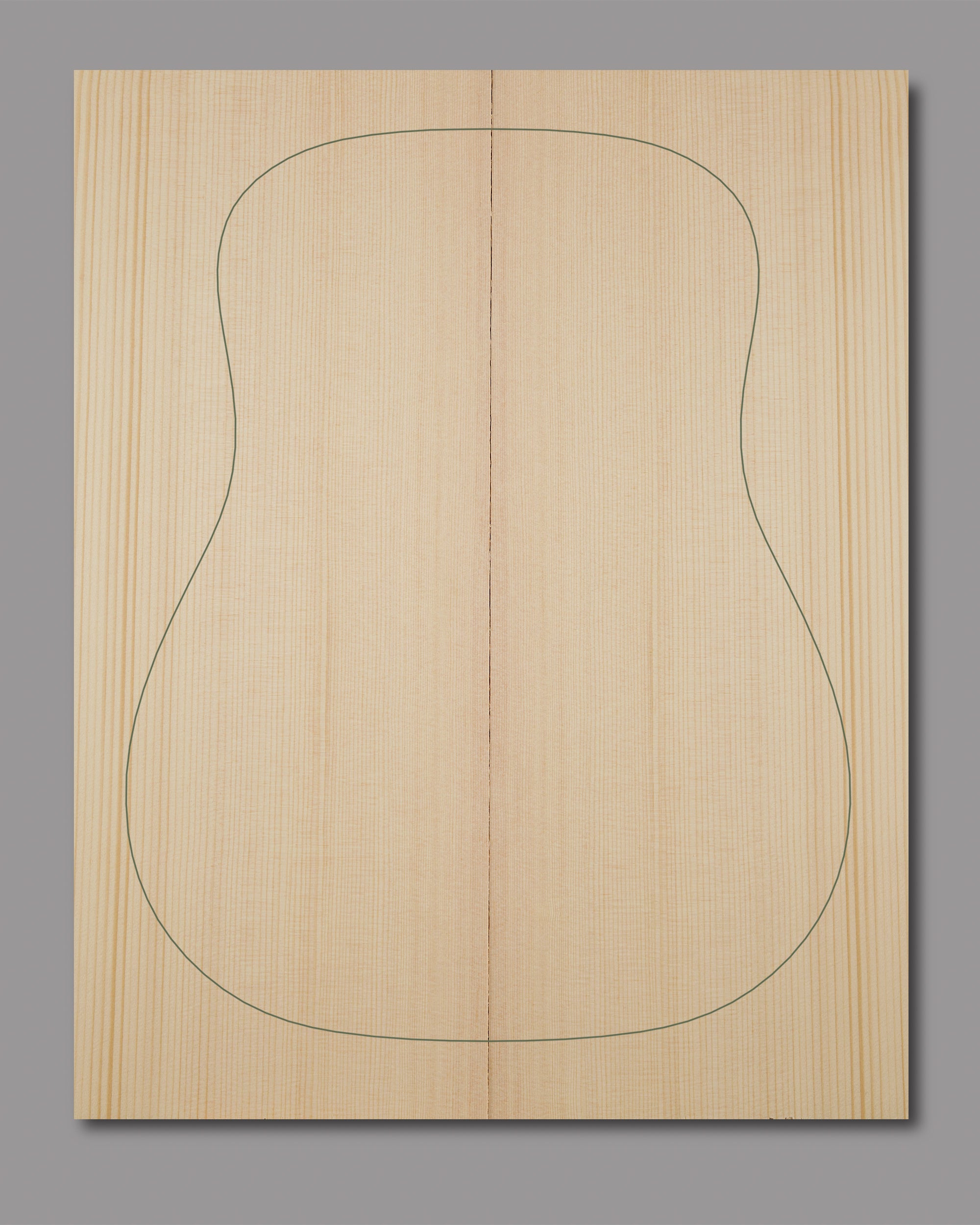 Precision-matched Sitka spruce soundboard with fine grain and warm acoustic properties.