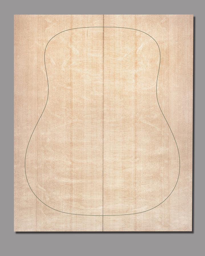 Bearclaw-figured Sitka spruce soundboard set with bookmatched grain and guitar body outline. The creamy colour and dynamic figure are clearly visible against a grey background.