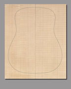 Handcrafted slipmatched Sitka spruce soundboard, highlighting organic wood figure with light color variations.