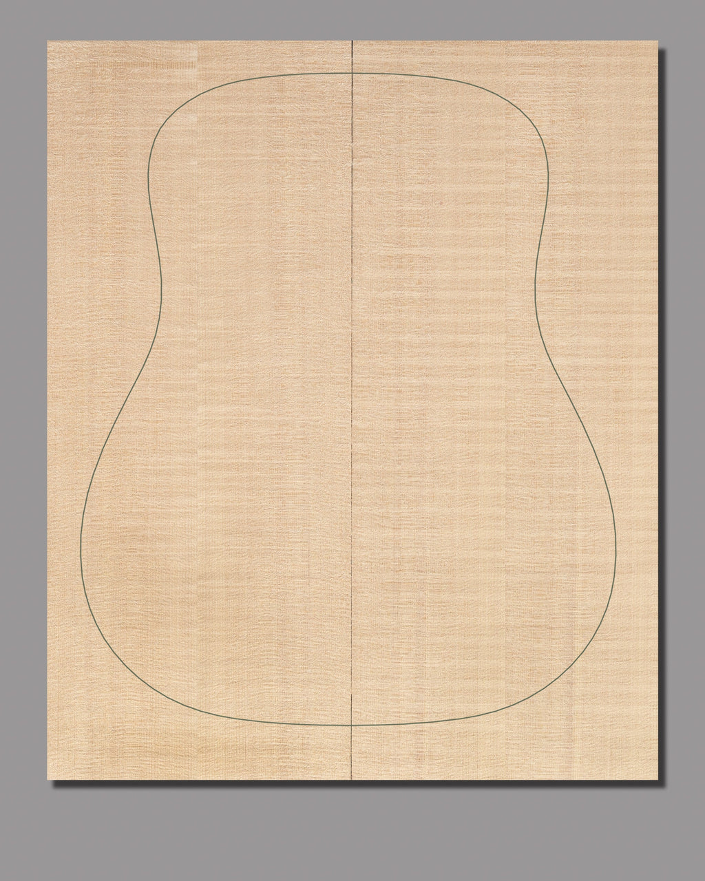 Slipmatched Sitka spruce soundboard, showcasing gentle figuring and a naturally blended aesthetic.