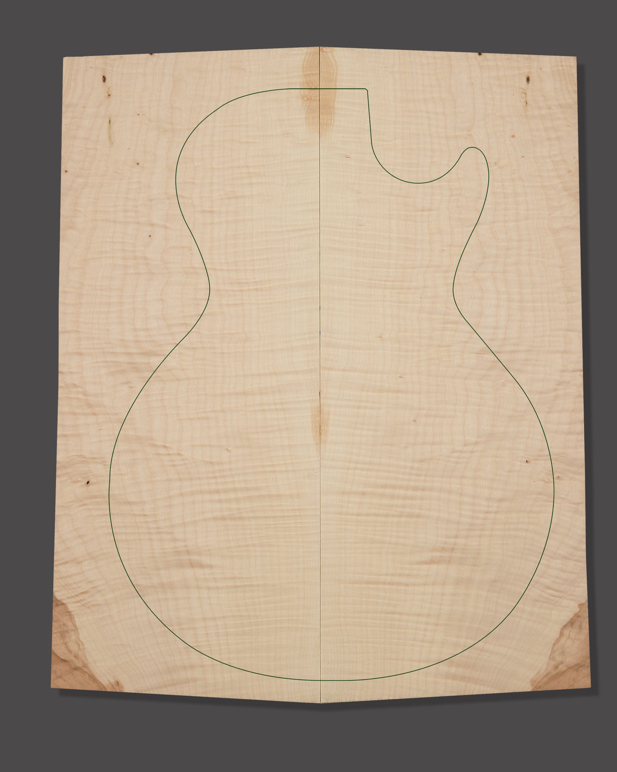 Maple electric guitar top with light flame figure and central symmetry. Notable colour shift on edges and light figuring throughout.