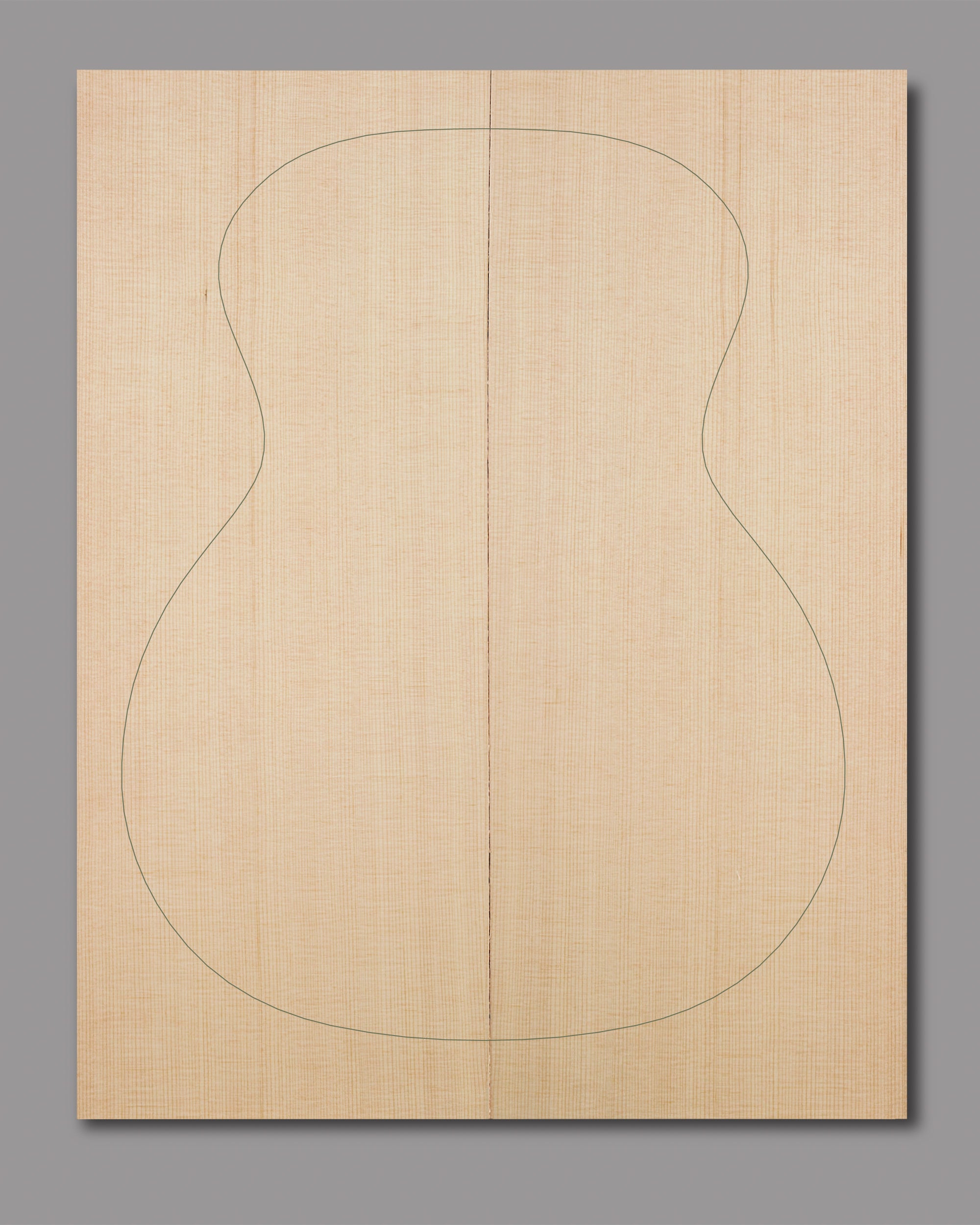 Tightly grained Sitka spruce soundboard with uniform width and soft amber tones, ideal for responsive, resonant acoustic guitars.