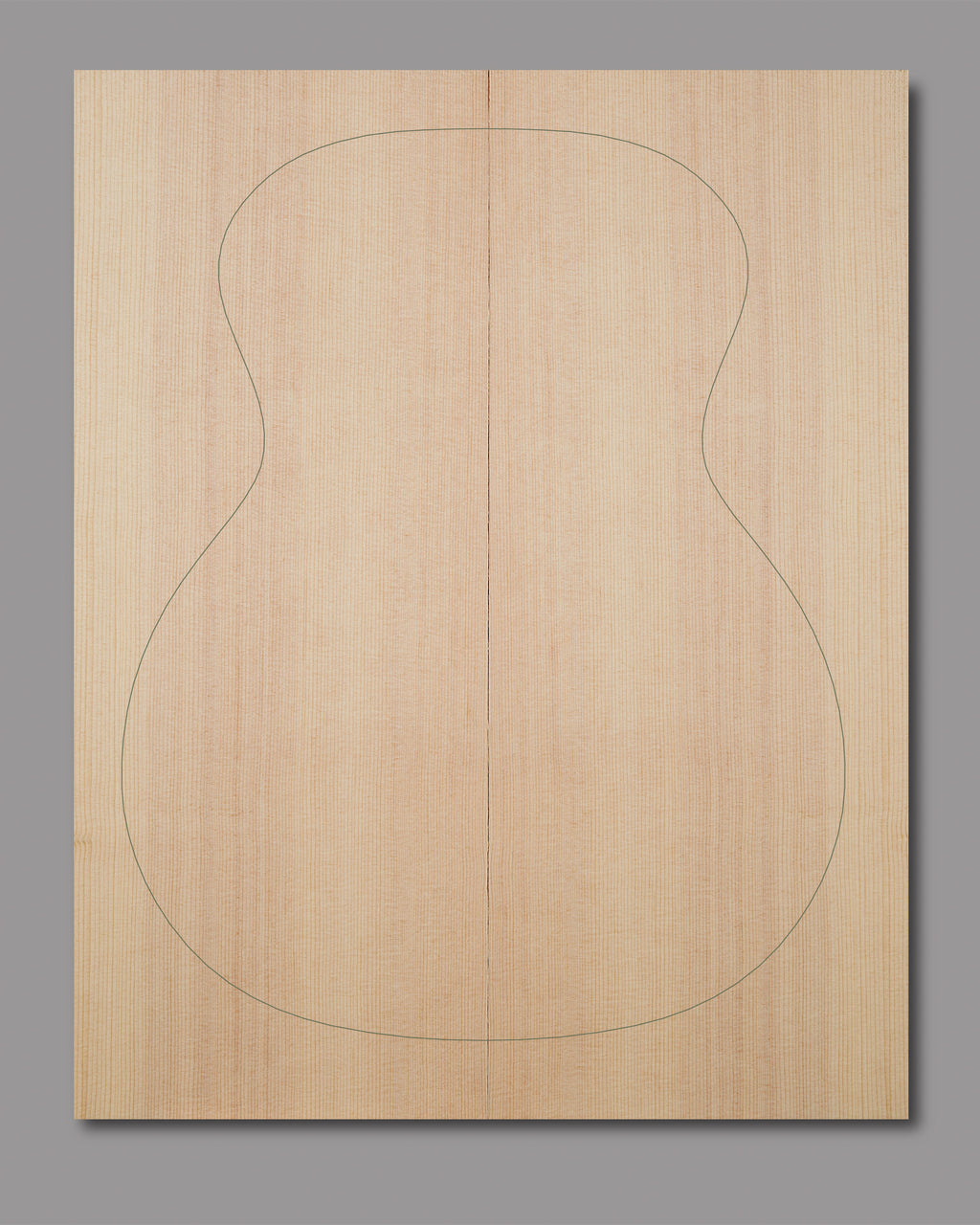 Natural Sitka spruce top with slight curl in outer grain lines and even texture, crafted for clarity and warmth in acoustic builds.