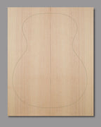 Natural Sitka spruce top with slight curl in outer grain lines and even texture, crafted for clarity and warmth in acoustic builds.