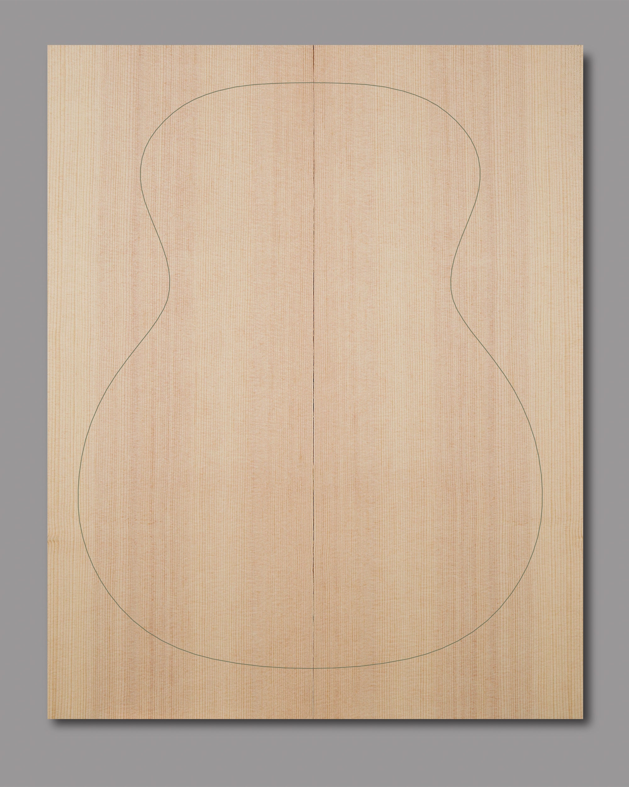 Natural Sitka spruce top with slight curl in outer grain lines and even texture, crafted for clarity and warmth in acoustic builds.